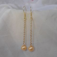 Welcome back to my shop: https://www.etsy.com/shop/pearlandjewelry Description of the product in the picture: I make them with 6mm golden Shell pearl pearls and sterling silver and golden sterling silver post,It is nice for your wedding. The earring is the total length of 5.5 cm The picture pearl color is golden. Can choose other colors are: golden, champagne, pearl white, bright red. Handmade Gold Bridal Earrings As Bridesmaid Gift, Hypoallergenic Gold Pearl Earrings For Party, Gold Dangle Earrings For Bridesmaid Gift, Classic Gold Earrings For Bridesmaid Gift, Gold Delicate Pearl Earrings For Bridesmaid, Classic Gold Earrings For Bridesmaids, Hypoallergenic Gold Earrings For Bridesmaids, Gold Dangle Pearl Earrings For Bridesmaids, Gold Pearl Earrings For Bridesmaid Gift