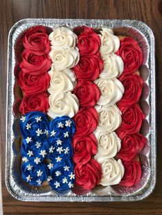 an american flag cake with red, white and blue frosting on it's side