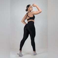 Black High Compression Legging With Pocket Made In Brazil. Sleek High Stretch Black Activewear, Sleek Black Activewear For Gym, Sleek Black Activewear For Sports, Sleek Black Training Activewear, Black High Stretch Squat Proof Leggings, Black Squat Proof Leggings For Pilates, Sleek Black Moisture-wicking Activewear, Squat Proof Black Leggings For Workout, Black Fitted Gym Leggings