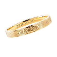 For Sale on 1stDibs - Antique yellow gold slip-on bangle bracelet dated 1912. * SPECIFICATIONS: DESIGN MOTIF: The engraved design motif repeats at each of the cardinal points. Elegant Engraved Cuff Bracelet For Formal, Formal Heirloom Yellow Gold Cuff Bracelet, Elegant Engraved Cuff Bracelet For Formal Occasions, Elegant Yellow Gold Bracelet With Decorative Band, Formal Yellow Gold Bracelet With Decorative Band, Formal Engraved Bangle Cuff Bracelet, Elegant Yellow Gold Bracelets With Decorative Band, Gold Bracelet With Decorative Band For Anniversary, Yellow Gold Bangle Bracelet With Decorative Band