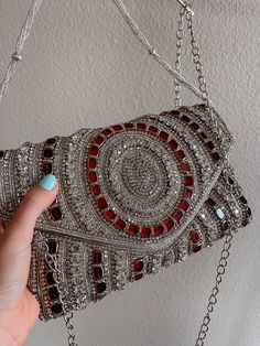 You don't have to be famous to live out your own red-carpet moment! our unique gorgeous handmade bags will help you in this. Emirates, Moroccan and Turk style in a single version. It's not just a bag this piece of art! Almost all bags presented in a single copy. The sparkling silver rhinestones glimmer, and beautiful tiny strap adds even more sparkle to this bag. With its lined interior, fits just the essentials. Elegant Clutch Evening Bag, Luxury Clutch Shoulder Bag With Rhinestones, Embellished Handheld Bag For Night Out, Embellished Handheld Bags For Night Out, Red Embellished Clutch Shoulder Bag, Luxury Rhinestone Clutch Shoulder Bag, Silver Evening Bag With Dust Bag For Party, Glamorous Embellished Bag For Night Out, Glamorous Silver Shoulder Bag