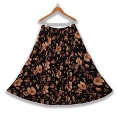 "Long Skirt- Floral Skirt- Maxi Skirt- Boho Skirt- Ankle Length Skirt- Peasant Skirt- Festival Skirt- Renaissance Folk Skirt- Vintage Hippie Skirt  Neo Nostalgia | Made in India   Women's long floral skirt- multicolored black/apricot/purple/beige/green/blue  Ankle-length depending on height | tapered hem       Stretchy elastic waist/hip band       Excellent vintage condition   Material - 100% Rayon | stretchy with give       Size - L - please check measurements>  Waist/hips (lax) - 26\"   Waist/ Bohemian Ankle-length Flowy Skirt, Traditional Flared Maxi Skirt For Spring, Bohemian Stretch Flared Skirt Bottoms, Relaxed Gathered Skirt For Festival, Relaxed Fit Gathered Skirt For Festivals, Floral Print Stretch Maxi Skirt, Traditional Wrap Skirt For Spring, Floral Print Stretch Tiered Skirt, Relaxed Festival Skirt