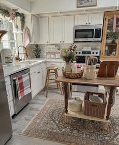 a kitchen filled with lots of furniture and decor