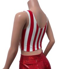 Made of our red stripe print spandex w/ red mesh inset in the front, this crop tank top fits snug to the body with plenty of stretch. Wear this to a rave, to the club, a rave, to a festival, or a night out. Also great for running, yoga, roller derby, or any activity.*We can make this top in any of our available fabrics - you can request the custom fabric choices in the personalization box if you prefer something other than what is shown in this listing. Striped Fitted Crop Top Tank, Fitted Striped Crop Top Tank, Stretch Sleeveless Rave Tops, Sleeveless Stretch Rave Tops, Red Sports Bra For Summer, Red Fitted Crop Top For Club, Red Fitted Cropped Tank Top, Fitted Red Crop Top For Club, Red Cropped Fitted Tank Top