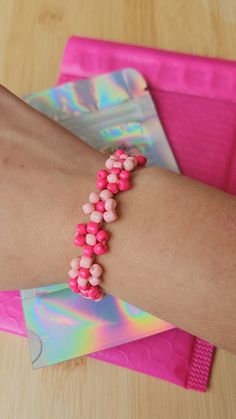 Cute pink flower bracelet! This bracelet is adjustable so it's easy to put on and take off. It also fits on all wrist sizes. Flower Bracelet, Pink Flower, Pink Flowers, Put On, Jewelry Bracelets, Beaded Bracelets, Bracelet, Flowers, Pink