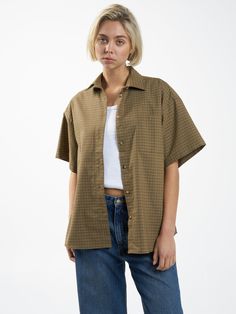 Combining Thrills' focus on style and comfort, the Dawson Plaid Shirt in Mustard Gold is thoughtfully crafted with a generously roomy fit for superior mobility and a plaid pattern to elevate any casual outfit. With a full button-up and a versatile length, this plaid shirt for women is easy to style. Leave it open and l Plaid Short Sleeve Shirt For Everyday, Brown Relaxed Fit Flannel Shirt For Workwear, Classic Plaid Tops For Casual Gatherings, Casual Gingham Shirt For Daywear, Relaxed Fit Gingham Button-up Shirt, Plaid Shirt With Placket For Workwear, Relaxed Fit Plaid Shirt For Daywear, Plaid Tops With Button Closure And Relaxed Fit, Plaid Top With Button Closure And Relaxed Fit