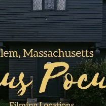 the front of a house that is black with yellow lettering and an image of a woman standing in front of it