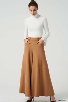 "This fashion brown wide leg pants is designer from XIAOLIZI. The long wool pants made high waisted + back zipper closure + front two up entry pockets + many front pleated add to the wide leg cut of our maxi pant, makes the warm pants more fashionable and warm in winter, it's elegant and classic womens pants, come on! Your wardrobe should have it. DETAIL * Made from Wool fabric, polyester lining * back zipper closure * two up entry pockets * winter pant, warm pant, long pants, maxi pants CUSTOM Beige Wide Leg Dress Pants, Beige Wide Leg Dress Pants For Fall, Full Length Wool Bottoms For Fall, Wide Leg Wool Dress Pants For Fall, Winter Wide-leg Bottoms With Pockets, Winter Wide-leg Pants With Pockets, Solid Wide Leg Winter Pants, Solid Color Wide Leg Winter Pants, Full Length Wool Pants For Spring