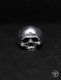 KAPALA RINGReady stock on Pewter materialSterling Silver 925 Made by orderShip from Jakarta, Indonesia.Standard shipping use DHL Global Mail takes 10 to 15 days.Express Shipping use DHL Express takes 4 to 7 working days.kindly chat me on conversation for any questionThanks for visiting my gallery. Handmade Punk Skull Rings, Symbolic Metal Skull Ring For Collectors, Silver Adjustable Symbolic Skull Ring, Silver Symbolic Skull Ring For Halloween, Symbolic Silver Skull Ring For Halloween, Handmade Silver Skull Ring For Halloween, Vintage Handmade Skull Ring, Silver Skull Ring In Punk Style, Silver Skull Ring Punk Style