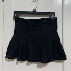 Black Mini Skirt With Button Detail. Never Worn. Black High Waist Mini Skirt With Buttons, High Waist Black Mini Skirt With Buttons, Black Mini Skirt With Button Closure, Casual Mini Skirt With Button Closure For Night Out, Casual Skirt With Buttons For Night Out, Casual Button Skirt For Night Out, Black Mini Bottoms With Buttons, Black Mini Skort With Buttons, Black Mini Length Bottoms With Buttons