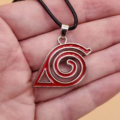 Unleash the spirit of the Shinobi with our Uzumaki Symbol Red Spiral Charm Necklace. This intricately designed accessory features the iconic red spiral and arrow emblem, a powerful symbol representing the Shinobi of Konoha and the enduring bonds of friendship. Metals Type: zinc Alloy Pendant Size: 30 X 25 mm Please be aware: International orders shipping outside of the US may take up to a month to arrive, regardless of the automatic shipping estimate provided by Etsy. I've observed additional delays in Canada - if you are in Canada, please anticipate a 5-week delivery period. However, there is an expedited shipping option available if you would like to receive your order within 2 weeks internationally. Red Spiral Jewelry As Gift, Red Spiral Jewelry For Gifts, Spiral Shaped Red Jewelry For Gifts, Adjustable Red Spiral Jewelry, Red Themed Necklace For Gift, Themed Red Necklace For Gifts, Themed Red Necklace For Gift, Uzumaki Symbol, Village Hidden In The Leaves