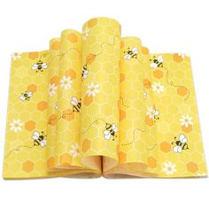 bees and honeycombs on yellow wrapping paper