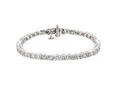 Pre-Owned 0.50ctw round white diamond, rhodium over sterling silver tennis bracelet. Measures approximately 7"L x 1/8"W and has a hidden box clasp..  This product may be a customer return, vendor sample, or on-air display and is not in its originally manufactured condition.  It may not be new.  In some instances, these items are repackaged by JTV. Silver Tennis Bracelet, Box Clasp, Tennis Bracelet, White Diamond, Diamond Bracelet, Tennis, Bracelet, Sterling Silver, Silver