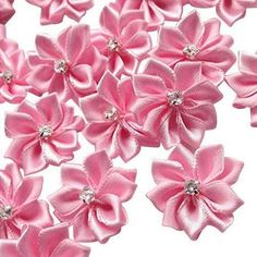 pink satin flowers with crystal centers on white background