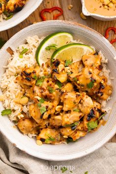 a white bowl filled with chicken and rice