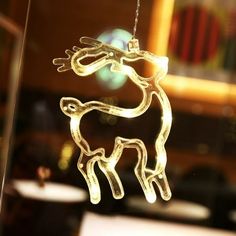 a glass ornament with a deer on it