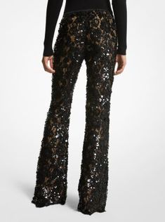 Intricately tailored in floral lace with nude silk lining these trousers are an ultra-romantic upgrade to basic flares. Featuring elaborate paillette hand-embroidery they’re designed with a concealed side-zip fastening and scalloped hem. Wear yours with a coordinating tunic or a shoulder-baring blouse. Glamorous Embellished Bottoms For Evening, Embellished Bottoms For Evening Parties, Embellished Bottoms For Evening Party Season, Embellished Evening Bottoms For Party Season, Embellished Bottoms For Evening And Party Season, Embellished Bottoms For Night Out In Fall, Fall Embellished Bottoms For Night Out, Glamorous Embellished Bottoms For Fall, Fitted Embroidered Bottoms For Wedding