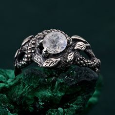 🌟 Warm Greetings, Jewelry Enthusiasts! 🌟 Step into a world where elegance meets personalization with our handcrafted silver rings. Each piece is a testament to unique artistry, blending mystical charm with modern finesse. Our collection offers a special touch for those who adore distinctive and thoughtfully designed jewelry. 🌈 Customization at Your Fingertips: Choose your perfect ring size and select from a variety of enchanting gemstones using our user-friendly dropdown menus. We delight in offering you the chance to create a ring that resonates with your personal style and story. ✨ Design It Your Way: Dreaming of a specific look? We're here to make it happen! Whether it's altering dimensions, adding extra gemstones, or choosing a different material, reach out to us. Your imagination i Mystical Engraved Wedding Jewelry, Mystical Round Crystal Promise Ring, Anniversary Gemstone Snake Ring, Anniversary Snake Ring With Gemstone, Nature-inspired Round Moonstone Promise Ring, Sterling Silver Fantasy Ring, Fantasy Handmade Jewelry For Promise Ring, Mystical Crystal Ring For Anniversary, Handmade Fantasy Wedding Rings