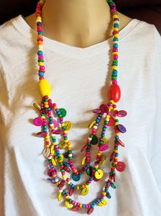 Colorful Statement Necklace Boho Ethnic Handmade Wood Beads. Stylish Necklace that will work with most outfits. This is a must have for to compliment your wardrobe. Lightweight and Easy on and Off. Makes a nice gift or just for yourself! Comes in a Gift Bag. Traditional Beaded Necklaces For Summer Festivals, Multicolor Beaded Bohemian Jewelry, Bohemian Multicolor Beaded Jewelry, Wooden Beads For Festival, Bohemian Multicolor Jewelry With Large Beads, Bohemian Summer Necklaces With Large Beads, Colorful Bohemian Beaded Chain Jewelry, Summer Bohemian Necklaces With Large Beads, Large Bohemian Beads For Summer