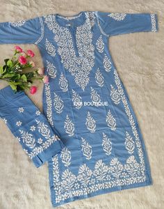 Description ▪ Kurti Fabric: Modal Cotton ▪ Kurti Length: 46-48 Inches ▪ Pant Fabric: Modal ▪ Pant Length: 38-40 Inches ▪ Sleeves : 3/4 Sleeves ▪ Style : Straight Kurti ▪ Occasions : Casual Wear, Office Wear, Festive Wear ▪ Garment Care : Hand Wash Only ▪ Price Includes : 1x Kurti, 1x Pant Disclaimer: Embroidery may be little vary due to various human hand involvement. Delicate Chikan hand embroidery on the cotton fabric. This kurti is the epitome of class and beauty. Tailored in straight fit; th Traditional Straight Kurta Embroidered Dress For Navratri, Traditional Embroidered Dress Straight Kurta For Navratri, Traditional Embroidered Straight Kurta Dress For Navratri, Fitted Blue Fabric With Chikankari Embroidery, Bollywood Straight Kurta Embroidered Dress For Festivals, Bollywood Style Embroidered Straight Kurta For Festivals, Bollywood Style Fitted Embroidered Dress For Eid, Fitted Bollywood Embroidered Dress For Eid, Fitted Embroidered Dress With Zari Work For Diwali