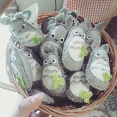 a basket filled with stuffed animals sitting on top of a table