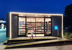 an outdoor store with stairs leading up to the door and shelves full of beverages on display