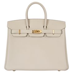 100% authentic Hermès Birkin 25 bag in Craie (cream) Veau Togo leather with gold-plated hardware. Lined in Chèvre (goat skin) with an open pocket against the front and a zipper pocket against the back. Has been carried once and is in virtually new condition. Protective stickers are intact except on tiret and back plate. Comes with key,lock, clochette, dust bag and receipt. Measurements Model H041344CC 10 Height 20cm (7.8in) Width 25cm (9.8in) Depth 13cm (5.1in) Drop of the Handle 5.5cm (2.1in) H French Tote Bag, Embroidered Shoulder Bag, Expensive Bag, Cream Bags, Hermes Birkin 25, Togo Leather, Kelly Bag, Vintage Hermes, Luxury Purses