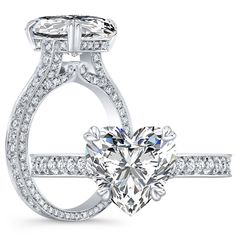 a heart shaped diamond engagement ring on a white background