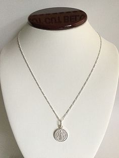 "925 STERLING SILVER SAINT BENEDICT NECKLACE 20\" LONG... FOR GOOD LUCK ,PROSPERITY AND PROTECTION. MADE IN ITALY-BEST QUALITY PENDANT : 24 mm X 15 mm CADENA DE SAN BENITO EN 925 PLATA ESTERLINA 20\" LARGO .. PARA PROSPERIDAD, BUENA SUERTE Y PROTECCION. HECHO EN ITALIA-MEJOR CALIDAD DIJE: 24 mm X 15 mm" Sterling Silver Hallmarked Pendant Charm Necklace, Sterling Silver Pendant Charm Necklace, Sterling Silver Hallmarked Pendant Charm Necklaces, Sterling Silver Oval Pendant, White Sterling Silver Spiritual Charm Necklaces, Sterling Silver Oval Pendant With Clasp, Sterling Silver Jewelry With Oval Pendant, Spiritual White Sterling Silver Charm Necklace, White Sterling Silver Necklaces Stamped 925