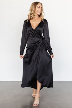 Stunning jet black color Satin like material with no stretch If in-between sizes we recommend sizing down True wrap style with V-neckline Buttons on sleeve cuffs Wrap style with sash Maxi tulip skirt Not lined 53% Polyester-recycled and 47% Polyester Trina is 5'6, cup size 32D, size 2 and is wearing size S Wrap Dress Wedding Guest, Maxi Dress Winter, Jet Black Color, Tulip Skirt, Long Sleeve Wrap Dress, Wrap Maxi Dress, Maxi Dress Black, Black Wrap, Black Wrap Dress