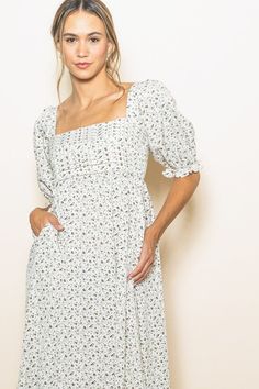 Expertly crafted with a ruching pleat detail bodice and a smocked back, the Alison Floral Maxi Dress offers both style and comfort. The square neck adds a touch of sophistication while the side pockets provide practicality. Its extra wide flare offers a flattering silhouette. 100% Polyester Casual Smocked Dress With Square Neck, Casual Smocked Dress With Square Neck And Smocked Back, Fall Square Neck Dress With Smocked Back, Casual Dress With Smocked Bodice And Square Neck, Casual Square Neck Dress With Smocked Bodice, Spring Square Neck Smocked Dress With Smocked Back, Chic Fitted Smocked Dress With Square Neck, Daywear Midi Dress With Smocked Bodice And Square Neck, Daywear Square Neck Midi Dress With Smocked Bodice