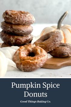 pumpkin spice donuts on a cutting board with the words, good things baking co