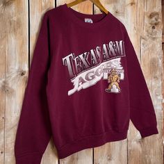 Vintage Texas A&M Aggies College Crewneck Sweater  - tagged size L - measures 22x25 - made in USA - no flaws ~ Unless stated otherwise, each piece is vintage.  That being said, flaws are common so please be mindful. Flaws such as pilling, staining, cracking, yellowing, fading and holes are often present. The severity of these flaws will vary piece by piece. I do my best to display these, so please thoroughly examine the photos provided. All major issues will be shown, but there is a possibility College Crewneck, Texas A&m, Great Gift Ideas, Crewneck Sweater, Crew Neck Sweater, Unisex Sweatshirt, Father's Day, Gender Neutral, Texas