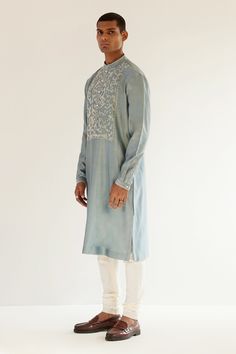 Powder blue chanderi kurta with an embroidered yoke. Comes with churidar.
Component: 2
Pattern: Embroidery
Type Of Work: Abstract
Neckline: Mandarin
Sleeve Type: Long sleeves
Fabric: Chanderi
Color: Blue
Other Details: 
Abstract embroidery
Occasion: Mehendi and Puja - Aza Fashions Embroidery Abstract, Chanderi Kurta, Abstract Embroidery, Types Of Work, Pattern Embroidery, Fashion App, Churidar, Blue Abstract, Powder Blue