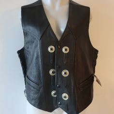 Nwt Mens Mordo Black Leather Western Snap Button Vest L * Retail: $366- Size: Large Color: Black Silver-Toned Hardware Snap Button Closure Side Seam Laced Detail Front Slip Pockets Made In Cancun Mexico Lined Material: 100% Leather- Shell Measurements (Flat): Armpits: 22.3" Waist: 21.2" Length: 25.6" Nwt, New With Tags. ...Rbn_lckr4901-4** Classic Winter Vest With Snap Buttons, Classic Leather Vest With Button Closure, Classic Button-up Vest With Snap Buttons, Classic Snap Button Vest, Classic Black Vest With Buttons, Vintage Black Vest With Button Closure, Mens Western Vest, Western Vest, Button Vest