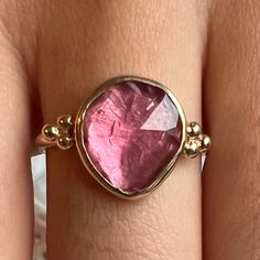 This freeform pink tourmaline is set in 14k yellow gold with gold accent beads, brilliant white diamonds and Emily's signature gold band. Approximate stone size: 12mm x 10mm Mohs Hardness: 7-7.5 Each piece is handmade with love in our Hudson Valley studio. This ring is one of a kind and currently ready to ship at size 7.5. Free resizing is available prior to shipping. Wall To Wall Carpet, Pink Stone Rings, Metal Clay Jewelry, Wall Carpet, Diamonds Ring, Local Jewelry, Jewelry Lookbook, Funky Jewelry, Gold Accent