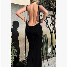 Egypt Backless Maxi Dress In Black, Crafted From Soft Fabric. If You Like To Stand Out, The Dress Is For You! This Gorgeous Piece Features Signature Back Drape. Designed To Make A Statement!! Never Worn Opted For Wearing The White Which You Can See On Pics. White Is For Sale As Well Material: 100% Polyester Stretch Factor: Slight Stretch You Can See Some Of My Outfits On Instagram @Cukycrisp Please No Offers On My Insta Page Fitted Maxi Dress With Strappy Back For Evening, Fitted Evening Maxi Dress With Strappy Back, Evening Sleeveless Backless Dress With Lace-up Back, Backless Stretch Maxi Dress For Night Out, Stretch Backless Maxi Dress For Night Out, Stretch Backless Maxi Dress For Date Night, Chic Backless Dress With Sheer Back, Fitted Black Maxi Dress With Strappy Back, Black Fitted Maxi Dress With Strappy Back