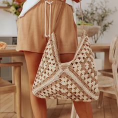 Hit The Beach With Our Cabana Tan/Ivory Hobo Tote! This Two Tone Woven Hobo Tote Bag Features A Faux Leather Strap And Comes In A Crochet Woven Straw Design. Paper/Polyester Blend. Zipper Closure. 1 Inside Open Pocket. 1 Inside Zipper Pocket. Summer Style Sand-colored Shoulder Bag, Beige Shoulder Bag For Vacation, Beige Rectangular Hobo Bag For Beach Season, Natural Hobo Bag With Adjustable Strap For Vacation, Summer Beige Straw Bag For Day Out, Bohemian Beige Bags For A Day Out, Eco-friendly Cream Straw Bag For Beach, White Hobo Tote Bag For Beach, White Tote Hobo Bag For Beach