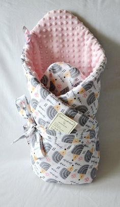 a baby sleeping bag with an elephant print on it