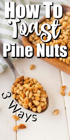 a wooden spoon filled with pine nuts next to a bowl of peanuts and the words how to roast pine nuts