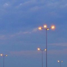 an empty parking lot at night with street lights