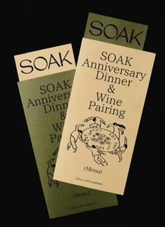 soak anniversary dinner and wine pairing menus are on display in the dark room