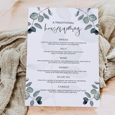 a traditional housewarming menu is displayed on a table