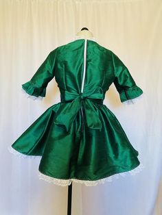 Victorian style taffeta dress with ruffled lace detailing Satin Ruffled Dress For Dress-up Occasions, Satin Ruffled Dress For Dress-up, Formal Taffeta Dress With Ruffles, Formal Taffeta Ruffle Dresses, Fitted Taffeta Dress With Ruffles, Green Satin Dress With Ruffles, Fitted Green Victorian Dress With Ruffles, Fitted Taffeta Dress For Costume Party, Fitted Satin Dress With Satin Bow