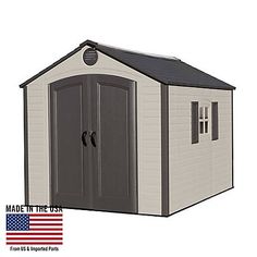 a small shed with the door open and an american flag in front of it on a white background