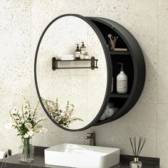 a bathroom sink with a mirror above it and shelves on the wall next to it