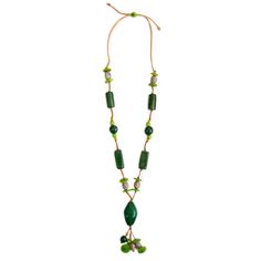 Unleash your creativity and embrace the playful spirit with the Alya Necklace. This long, adjustable necklace is a delightful fusion of unique tagua shapes, pambil, bombona seeds, and vibrant acai berries, making it the perfect accessory for retailers seeking a fun and imaginative piece that adds a burst of color and whimsy to any ensemble. Adjustable 34"-48" L Materials: Sustainable Tagua nut, Bombona seeds, Pambil, Acai Berries Faux Leather Cord Organic Vegetable dyes Handmade in Ecuador Due to the nature and size of the tagua nuts, all sizes are approximate...not exact. Colors may vary from the pictures slightly due to the nature of the Tagua Nut. Adjustable Wooden Beads Necklace In Nature-inspired Style, Artisan Adjustable Recycled Glass Necklace, Bohemian Adjustable Necklace With Recycled Glass, Adjustable Green Beaded Necklace With Wooden Beads, Adjustable Bohemian Necklace With Recycled Glass, Bohemian Adjustable Recycled Glass Necklace, Adjustable Green Recycled Glass Necklace, Green Fair Trade Necklace For Gift, Adjustable Green Beaded Necklace In Nature-inspired Style