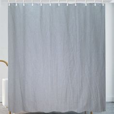 the shower curtain is closed and ready to be used in the bathroom or on the floor