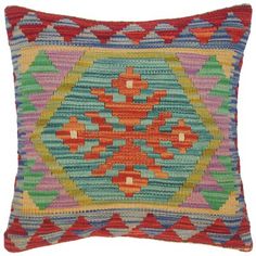 a multicolored pillow with an intricate design on the front and back side,