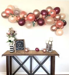 a table with some balloons on top of it